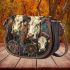 cows with dream catcher Saddle Bag