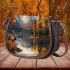 Create an oil painting of majestic deer standing saddle bag
