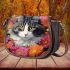 Curious cat among the blossoms saddle bag