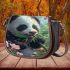 Cute baby panda eating bamboo saddle bag