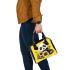 Cute baby panda with sunflowers on a yellow shoulder handbag