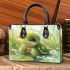 Cute baby turtle in the water small handbag