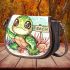 Cute baby turtle with big eyes sitting saddle bag