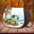 Cute baby turtle with big eyes sitting saddle bag