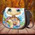Cute baby turtle with big eyes wearing colorful flowers saddle bag