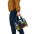 Cute black and tan dachshund in the garden with colorful tulips shoulder handbag