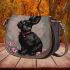 Cute black rabbit with a pink collar saddle bag