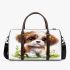 Cute brown and white puppy sits on the grass 3d travel bag