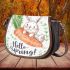 Cute bunny sitting on top of an carrot hello spring saddle bag