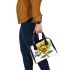 Cute cartoon bee holding a sunflower shoulder handbag