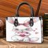 Cute cartoon bunny with a pink bow holding heart small handbag