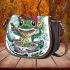Cute cartoon frog eating ramen shown in a full body shot saddle bag