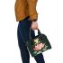 Cute cartoon frog jumping on top of a pink lotus flower shoulder handbag