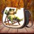 Cute cartoon frog sitting in the sun on an outdoor chair saddle bag