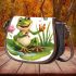 Cute cartoon frog sitting on a lily pad smiling with his legs crossed saddle bag
