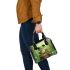 Cute cartoon frog sitting on a tree stump with big eyes shoulder handbag