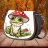 Cute cartoon frog sitting under an amanita muscaria mushroom saddle bag