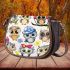 Cute cartoon owls sitting on tree branches saddle bag