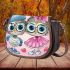 Cute cartoon owls wearing cute saddle bag