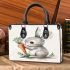 Cute cartoon rabbit holding a carrot small handbag