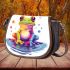 Cute cartoon rainbow frog sitting on a water puddle saddle bag