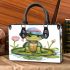 Cute cartoon turtle sitting on a lily pad small handbag
