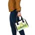 Cute happy frog in the grass near water shoulder handbag