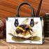 Cute little bee sitting on the flower small handbag