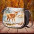 Cute little deer standing in the snow saddle bag