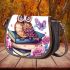 Cute owl sitting on books surrounded by pink roses saddle bag