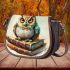 Cute owl sitting on top of books saddle bag