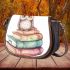 Cute owl sitting on top of books saddle bag