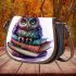 Cute owl sitting on top of books saddle bag