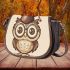 Cute owl wearing glasses and a graduation hat in a simple saddle bag