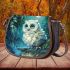 Cute owl with big blue eyes perched saddle bag