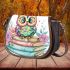 Cute pastel colorful owl sitting on top of books saddle bag