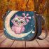 Cute pink owl with a bow and glasses sitting on the moon saddle bag