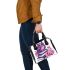 Cute purple owl sitting on top of books surrounded shoulder handbag