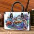 Cute sea turtle swimming in the ocean small handbag