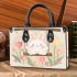 Cute white bunny surrounded by colorful tulips small handbag