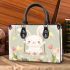 Cute white rabbit sitting on the swing small handbag
