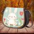 Cute white rabbit sitting on the swing saddle bag