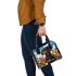 Dachshund in the garden with colorful tulips and butterflies shoulder handbag