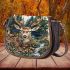 Deer head surrounded by forest and animals saddle bag