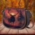 Deer with antlers standing in front of trees saddle bag