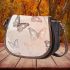 Delicate line art butterflies in shades of brown saddle bag