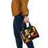 Dynamic composition of geometric shapes and colorful lines shoulder handbag