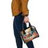 Elegant deer standing amidst autumn foliage shoulder handbag