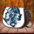 Featuring an array of shapes and forms in shades of blue and grey saddle bag