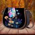 Glowing colorful butterfly among flowers in the moonlight saddle bag
